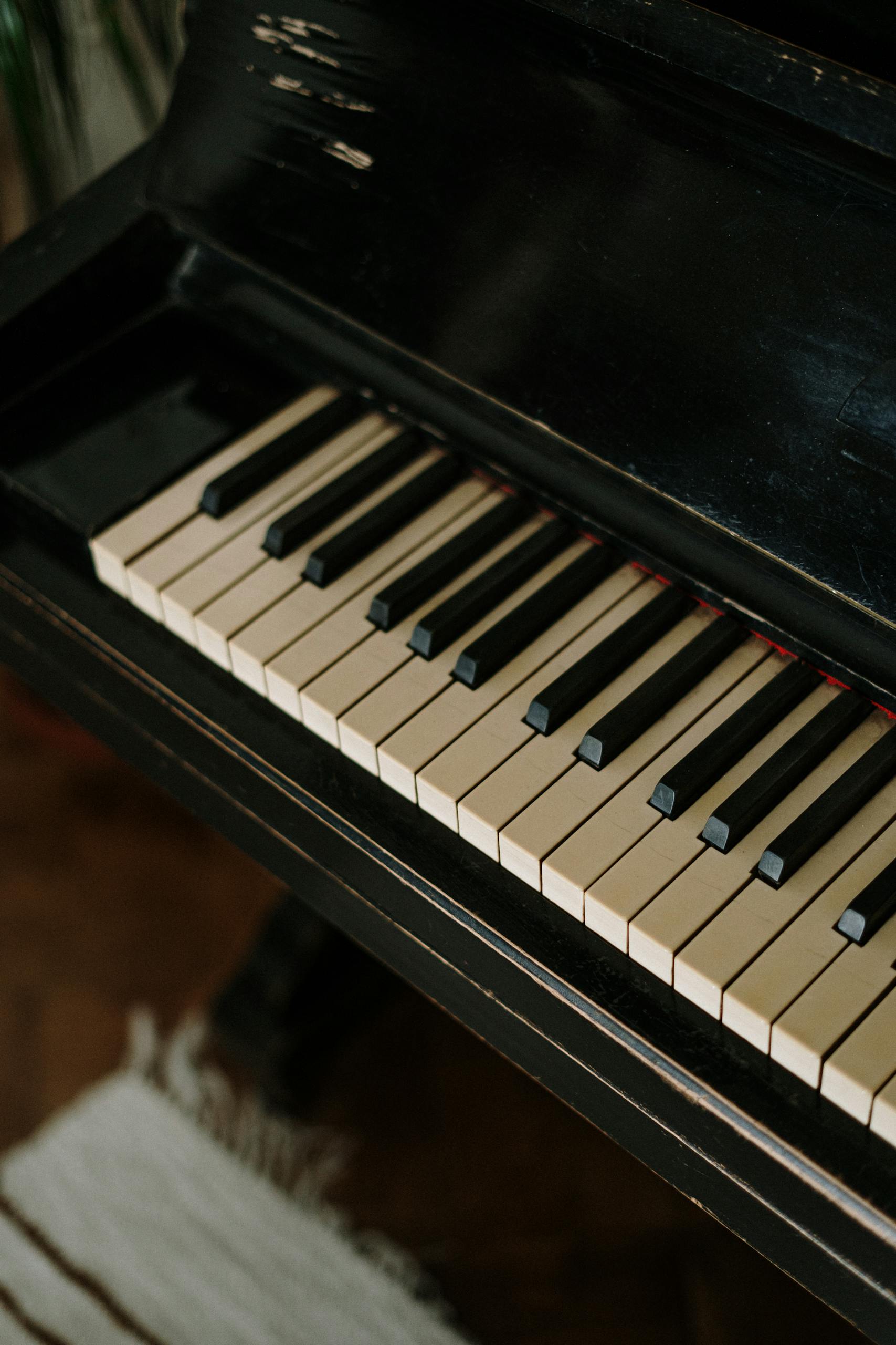Detailed shot of vintage piano keys highlighting their classic elegance and timeless appeal.